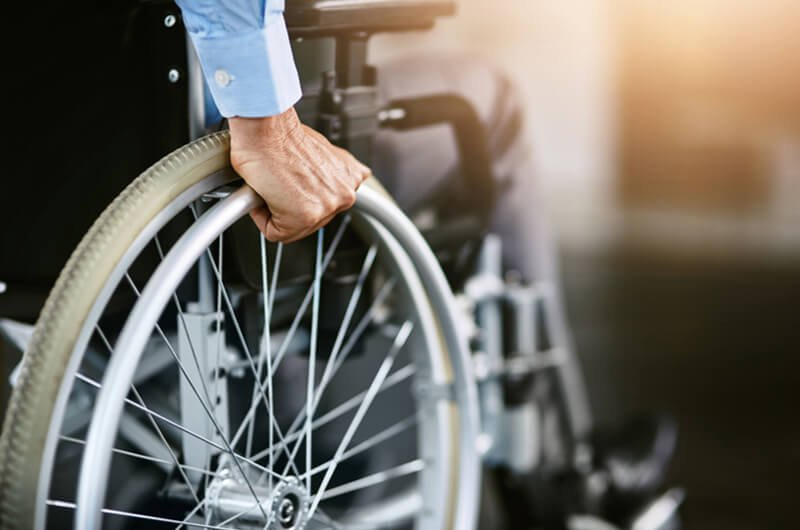 person in wheelchair - disability insurance protection - insurance planning services farmington ct