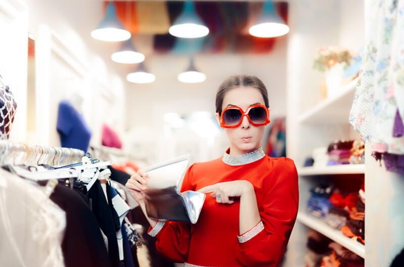 woman shopping with sunglasses - change spending habits - financial planning services farmington c