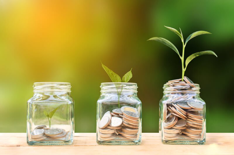 coins growing in jars conceptual - best rated wealth planning planning services in farmington CT