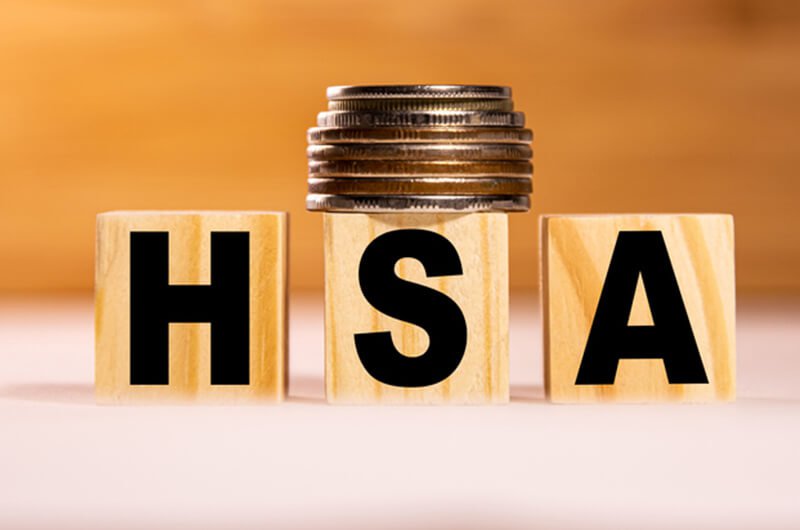 wooden blocks hsa and coins - health savings account retirement planning services in farmington CT