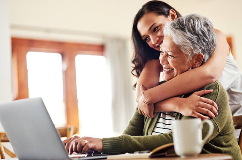 adult child holding parent - best rated financial planning services farmington ct